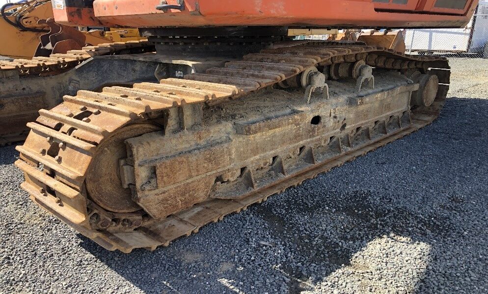 close up of worn tracks on an excavator